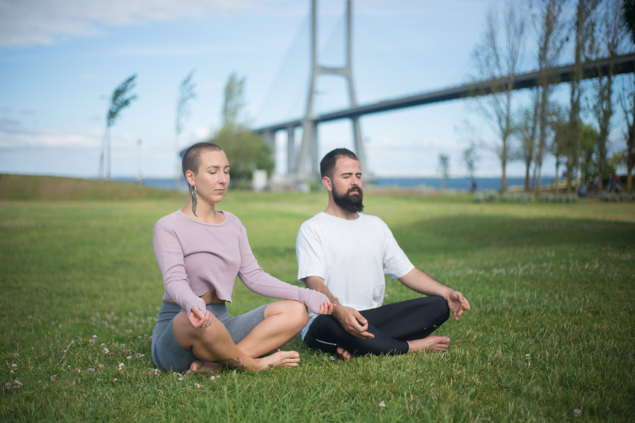 Two people doing Yoga