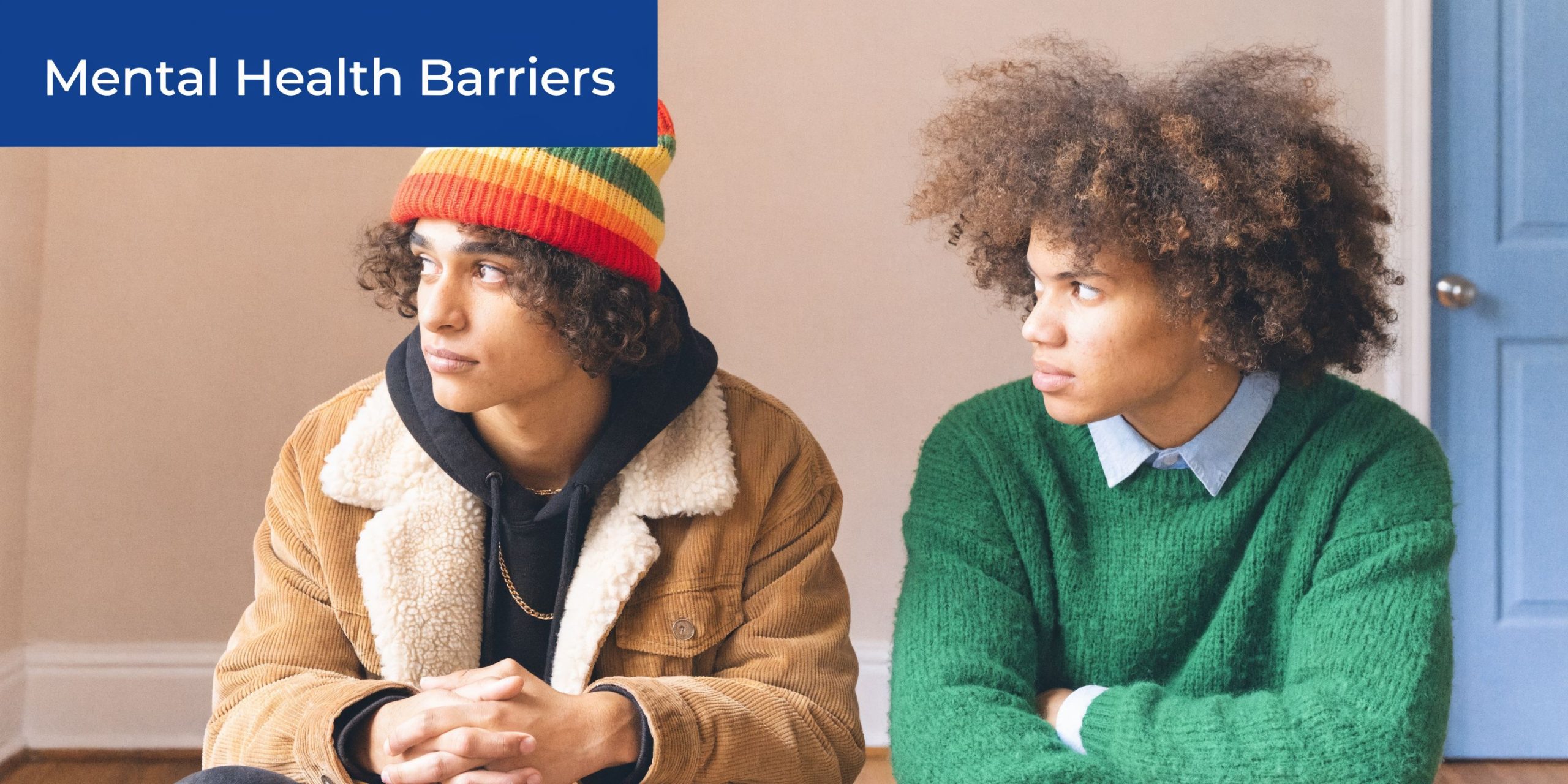 Two young men looking away from each other, symbolizing communication difficulties and emotional distance in relationships.