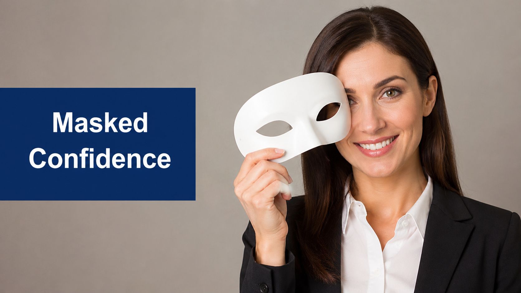 A professional woman in a business suit holding a white mask over her face while smiling confidently.